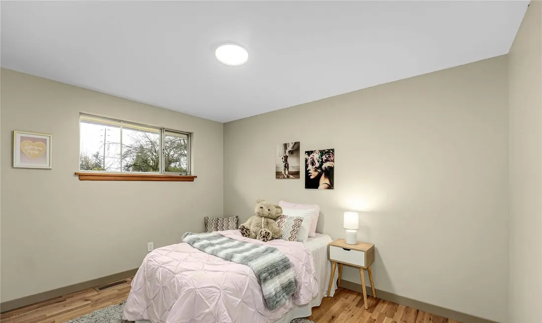 Bedroom with oak hardwood floors in a Kent whole-home remodel