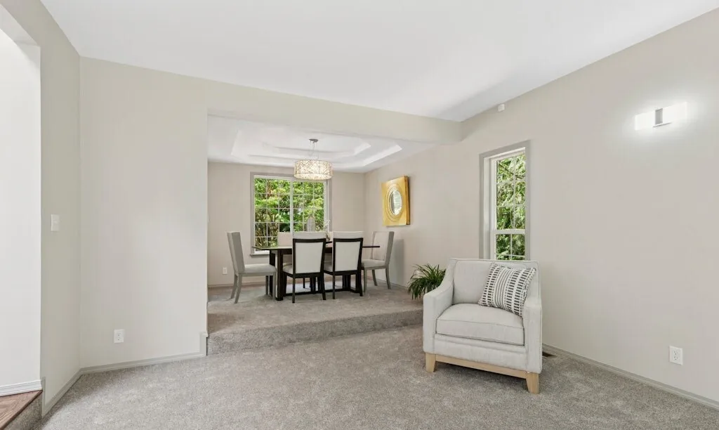 Finished living area opening to a bright dining room